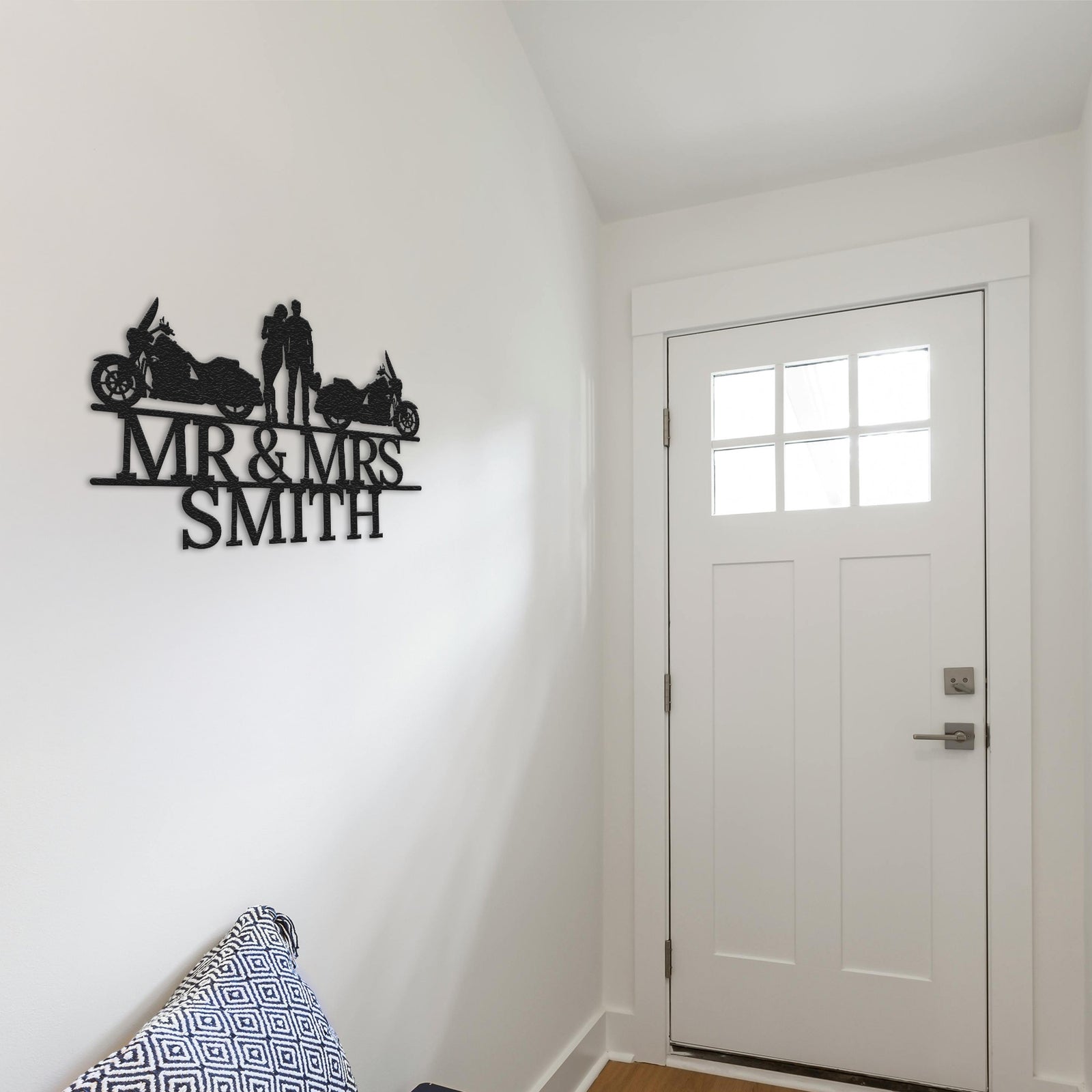 a white room with a white door and a black and white sign on the wall