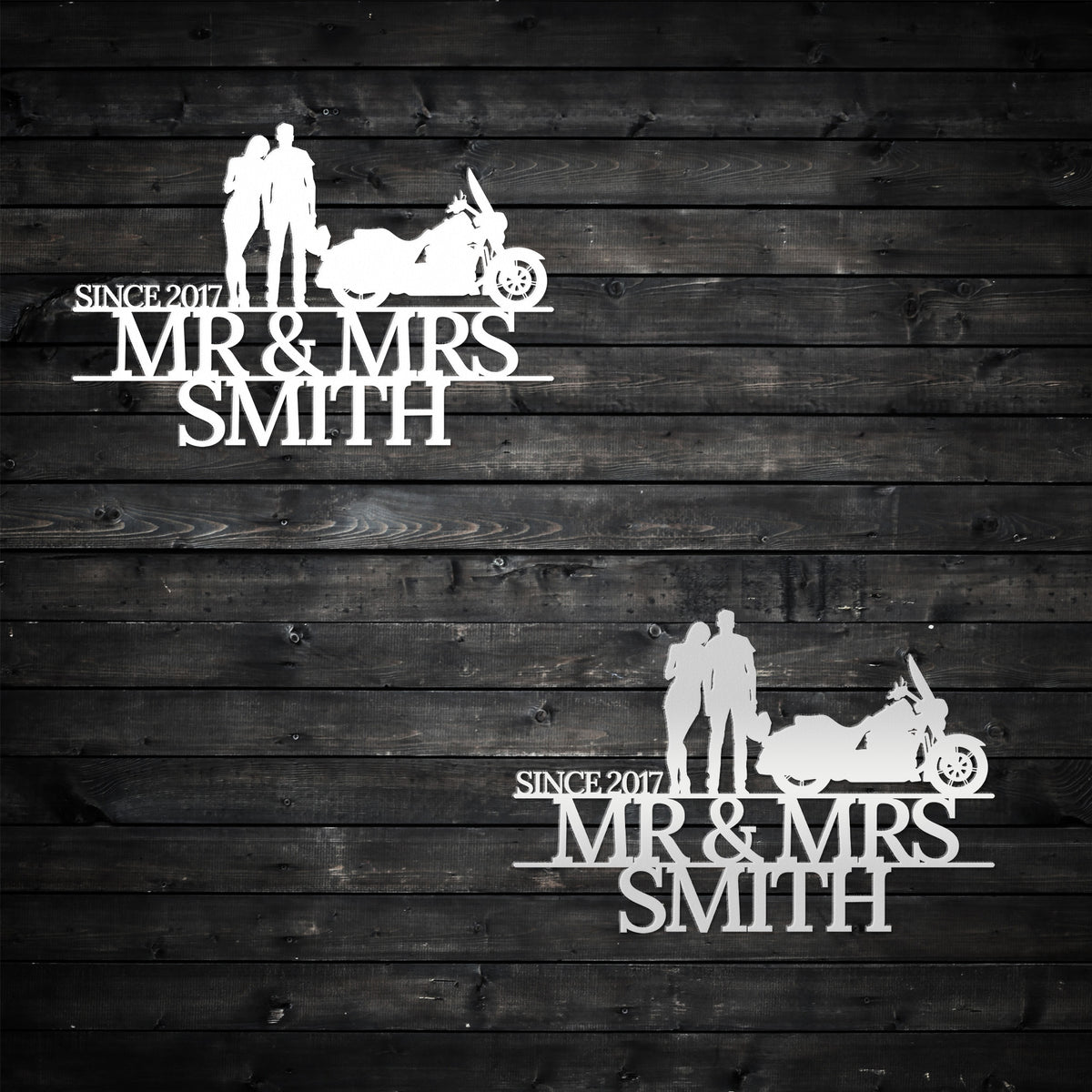 two wedding cake toppers on a wooden background