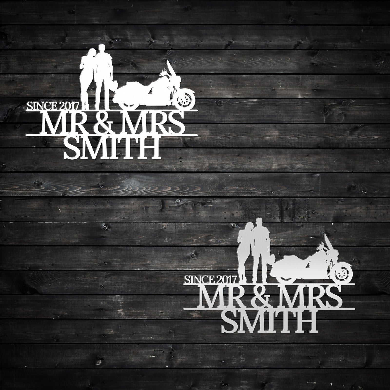 two wedding cake toppers on a wooden background