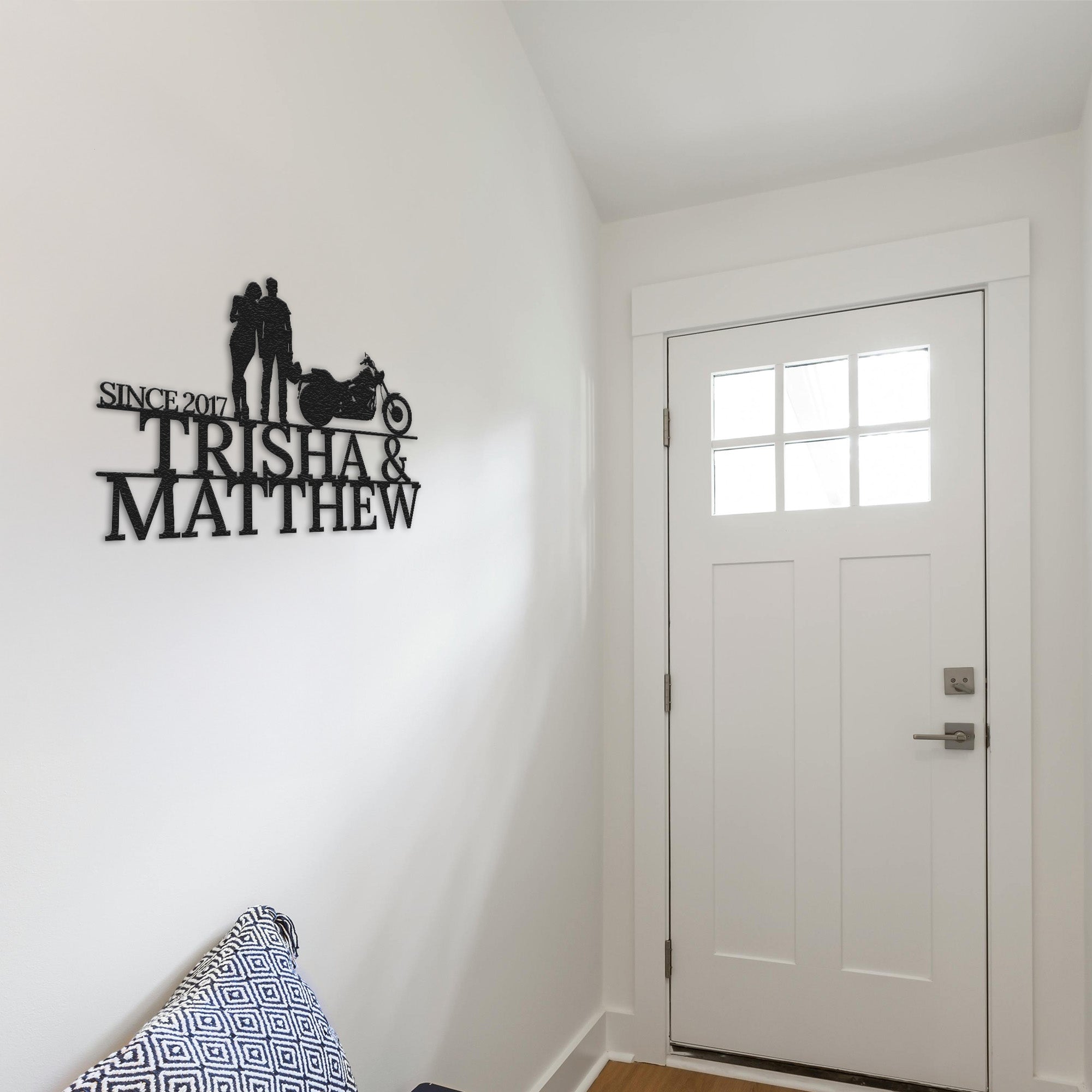 a white room with a white door and a black and white sign on the wall