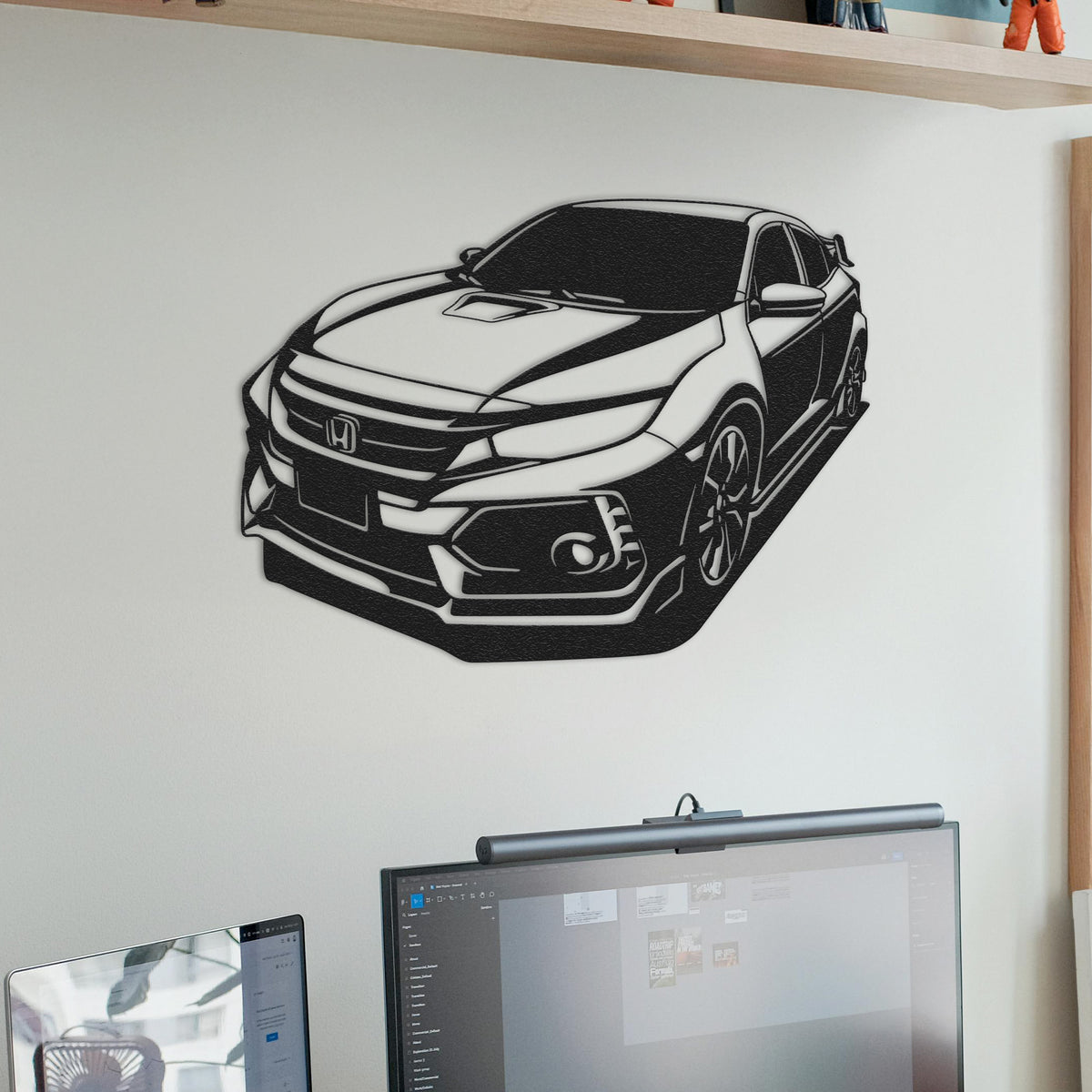 a black and white picture of a car on a wall