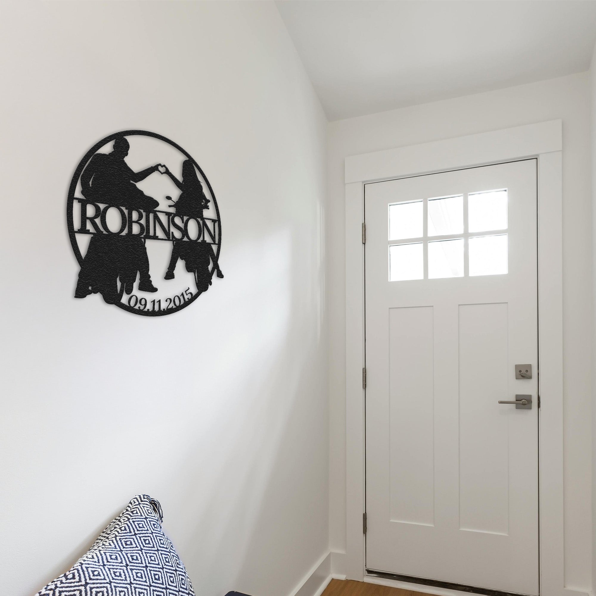 a room with a white door and a black and white sign on the wall