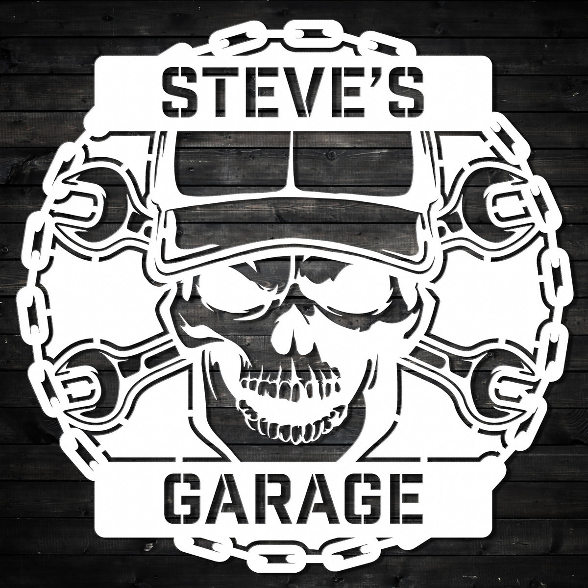 a skull wearing a helmet and wrenches with the words steve's garage