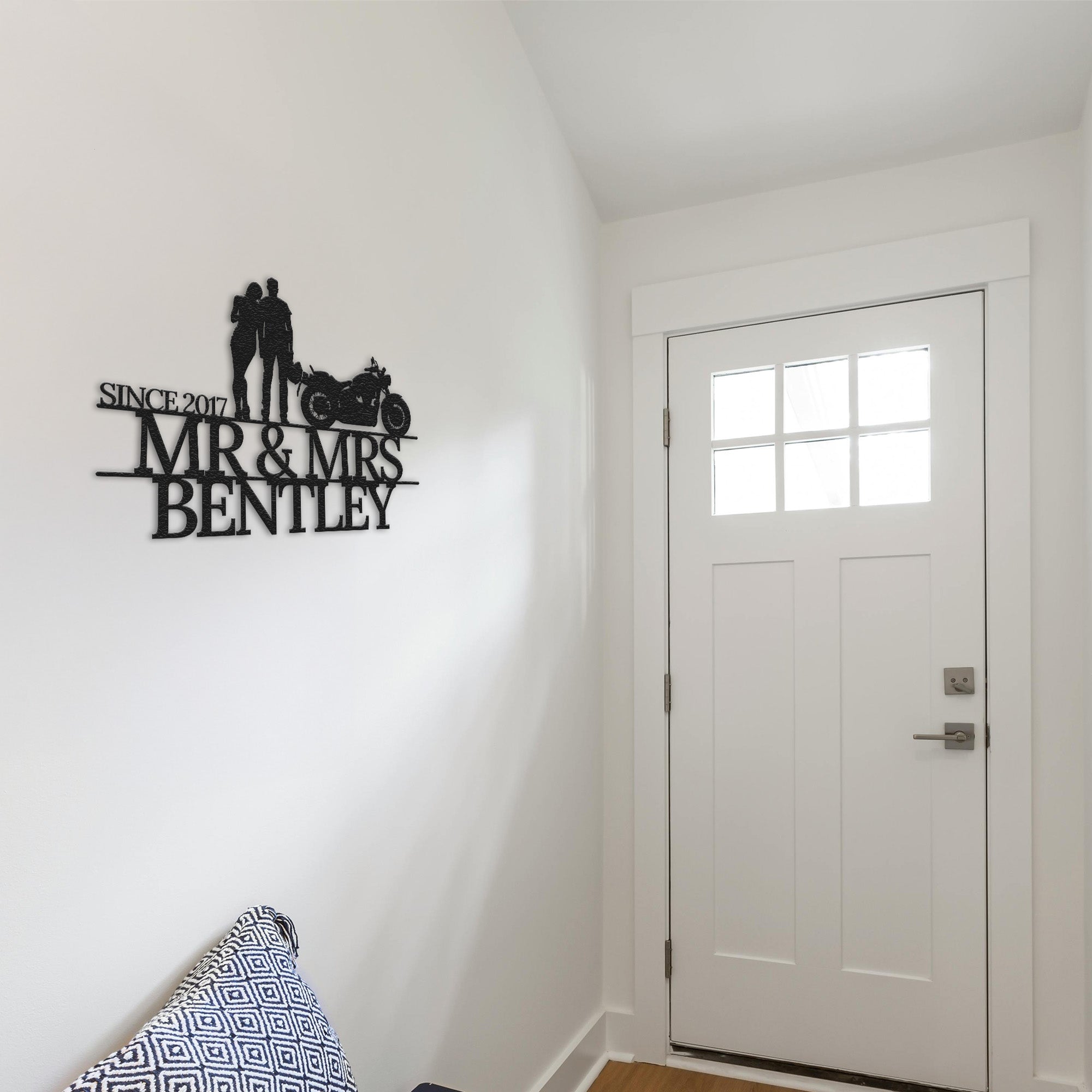 a room with a white door and a black and white sign on the wall