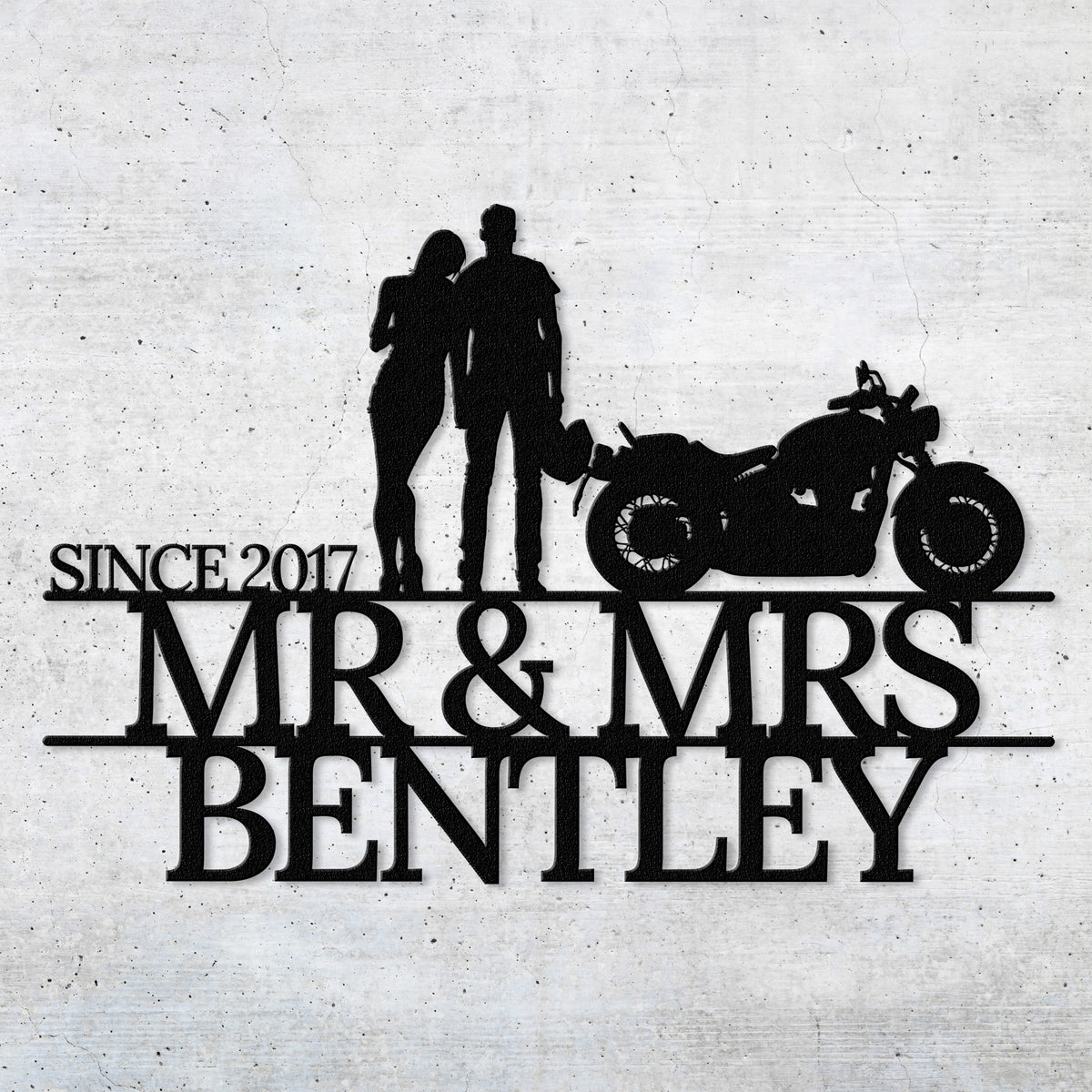 a silhouette of a man and a woman standing next to a motorcycle