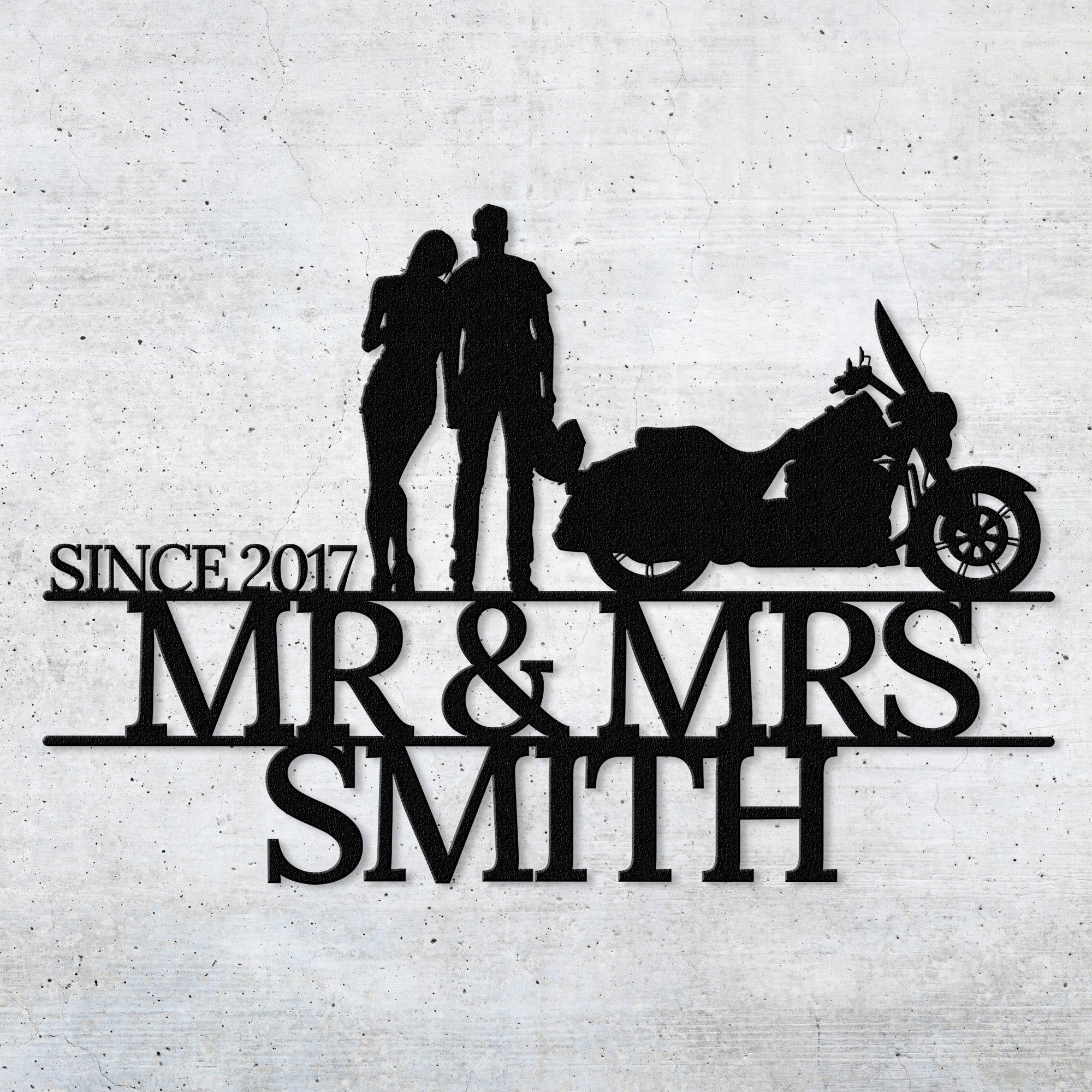 a silhouette of a man and woman standing next to a motorcycle